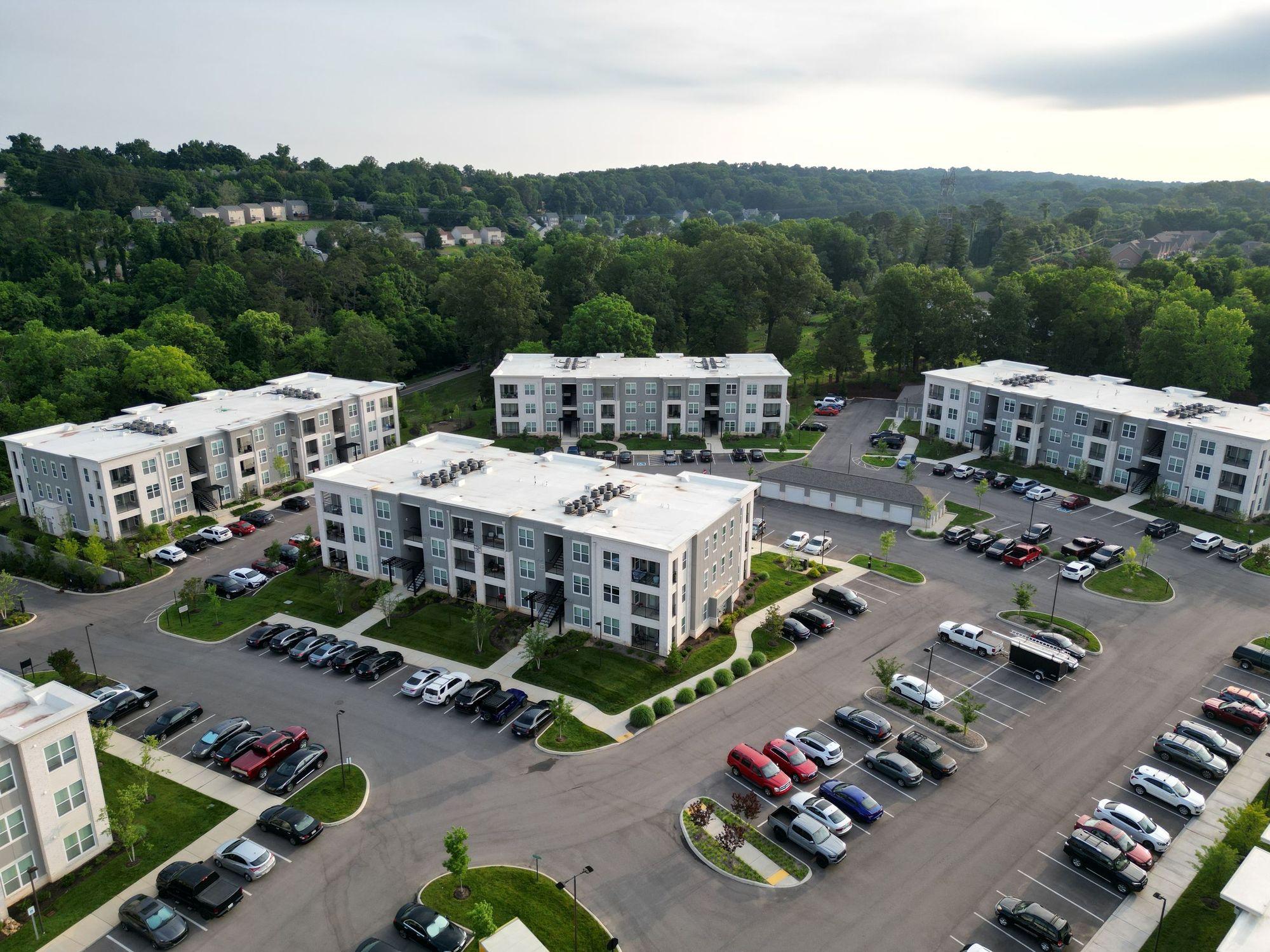 Aerial view of a garden-style apartment community with three-story buildings